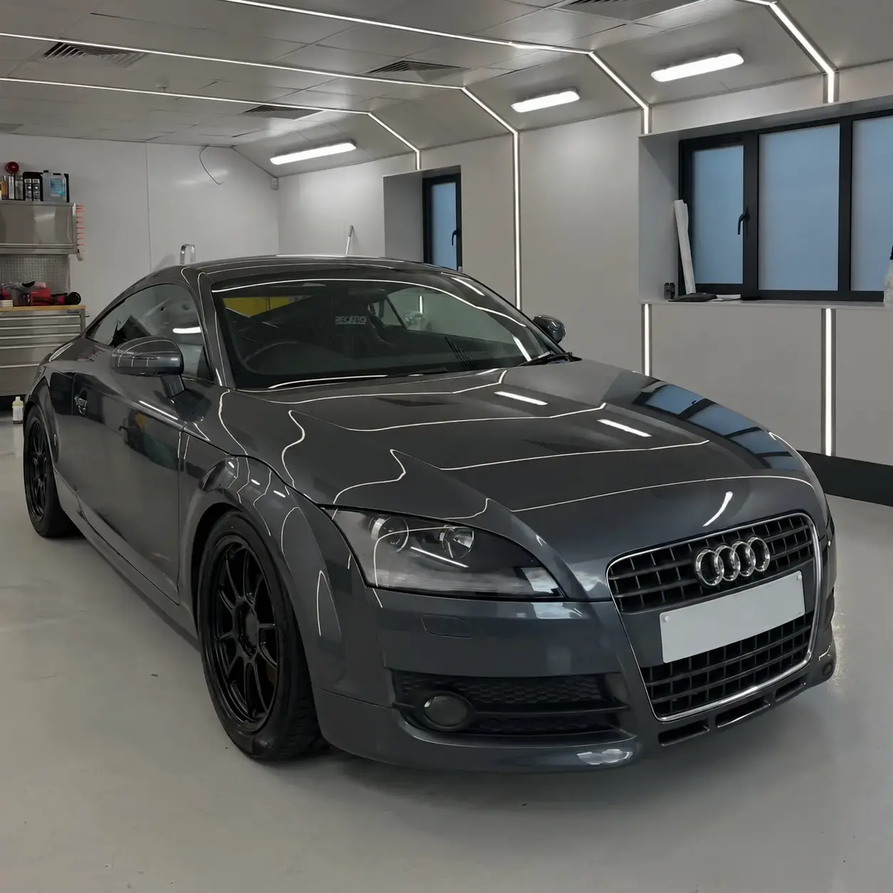 Grey Audi TT prepared inside the Auto Opulence valet bay in Norwich