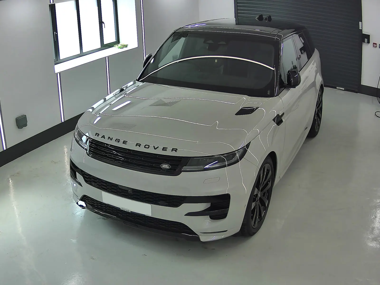 Merl Grey Range Rover Sport inside the Auto Opulence detailing bay after ceramic coating
