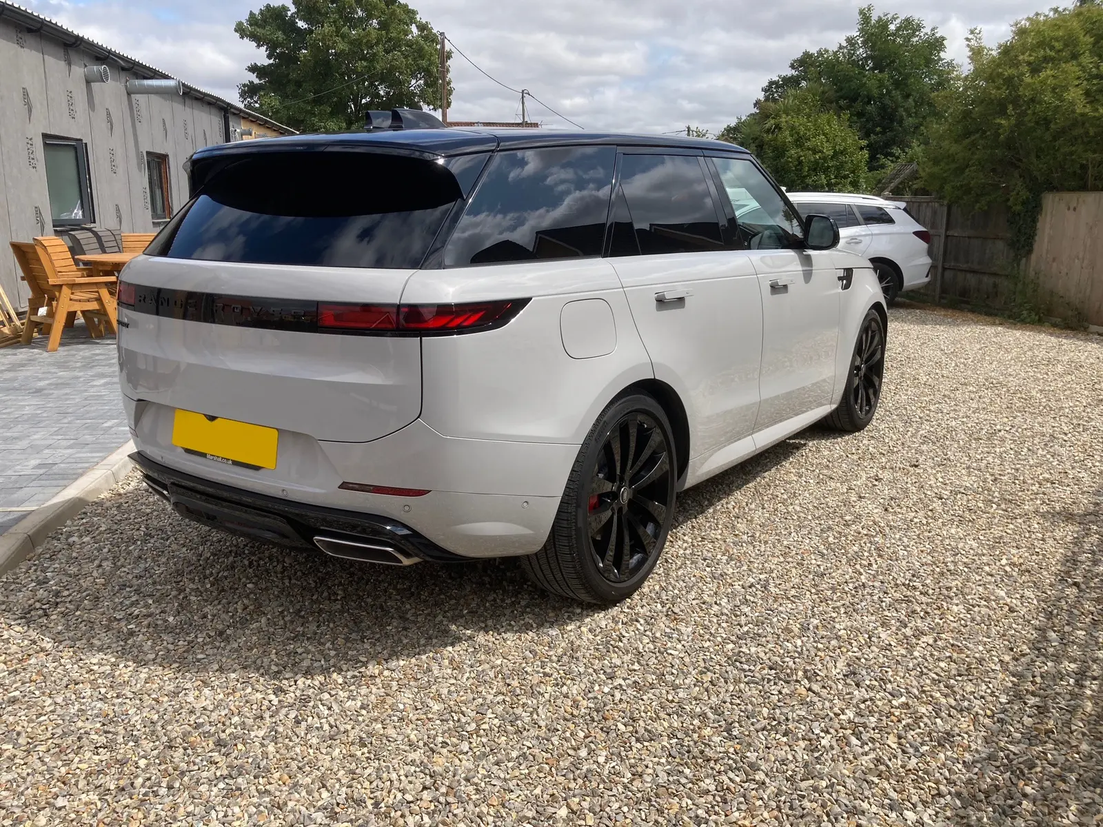 Rear three-quarter view of the ceramic coated Merl Grey Range Rover Sport in Norwich