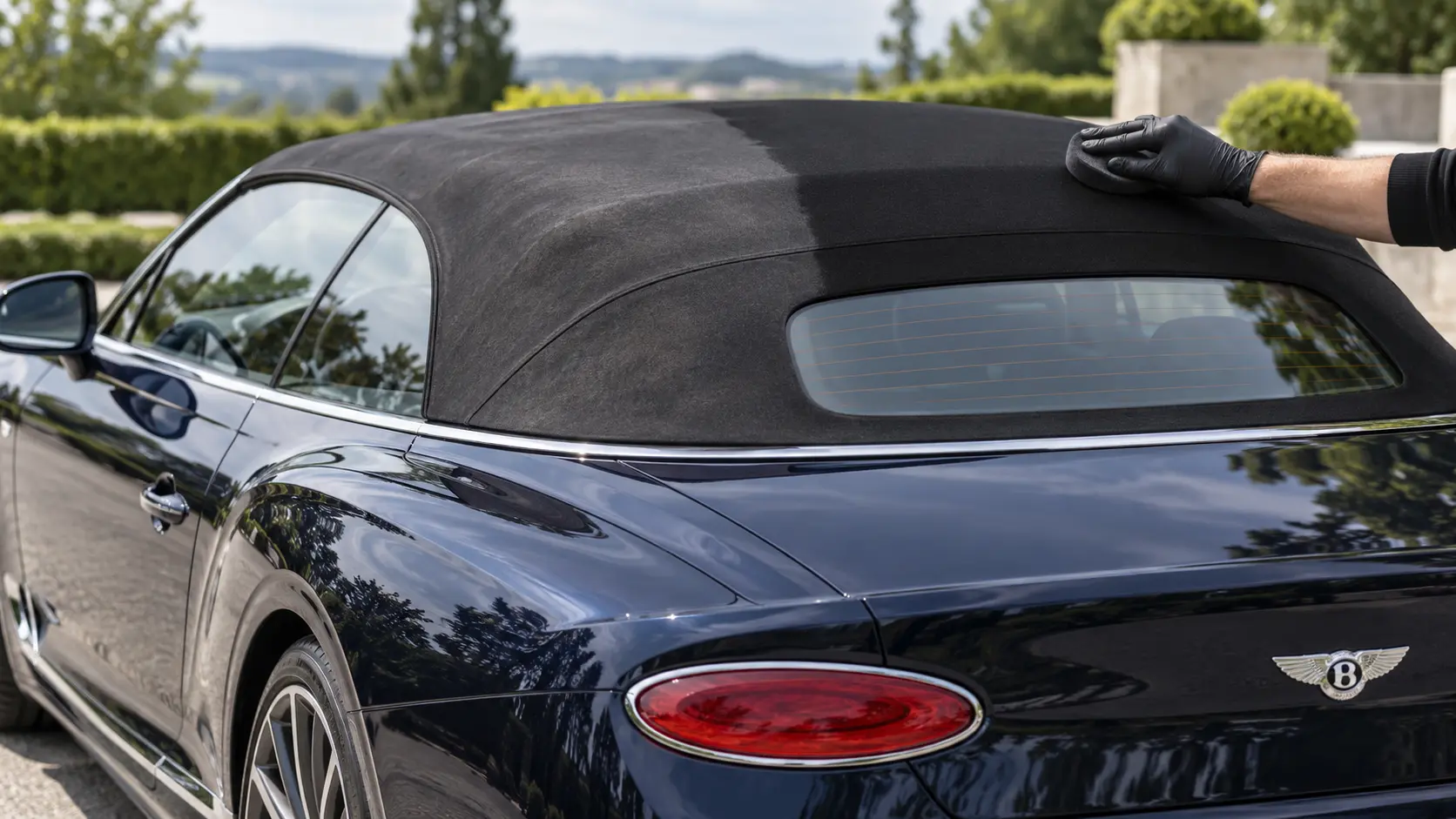 Navy Bentley Continental GTC soft top receiving re-dye and ceramic protection