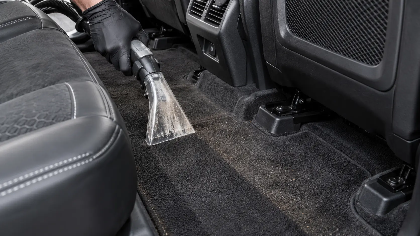 Land Rover Discovery Sport carpet being deep cleaned with a professional extraction tool