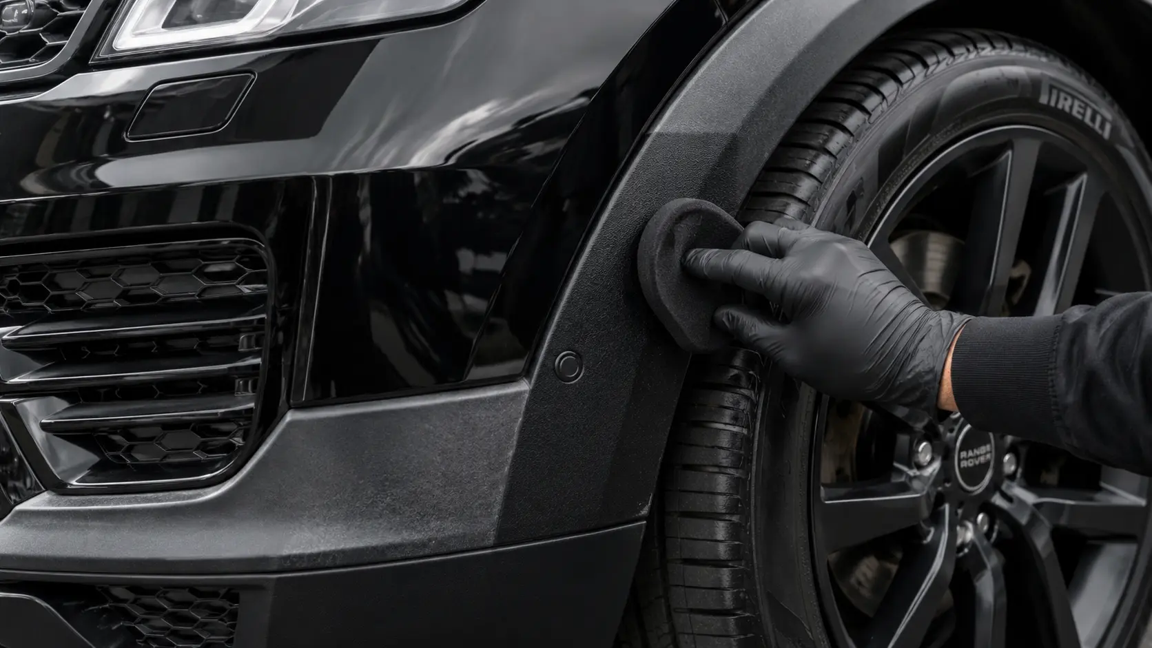Range Rover Sport exterior wheel arch trim being professionally rejuvenated